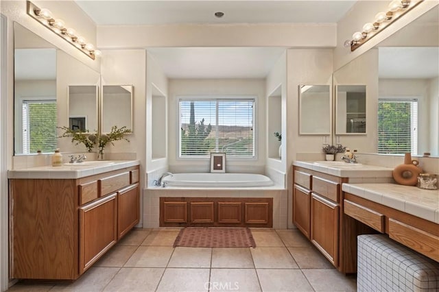 27625 Mariposa Ln, Castaic, CA 91384 - bathroom featuring plenty of natural light, two vanities, and a garden tub