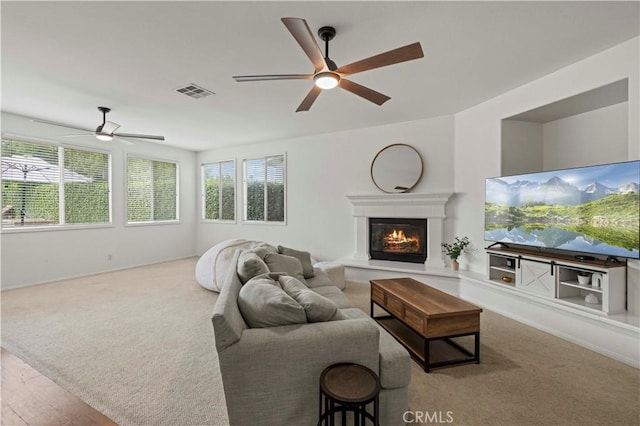 27625 Mariposa Ln, Castaic, CA 91384 - living room with ceiling fan, healthy amount of natural light, and a glass covered fireplace