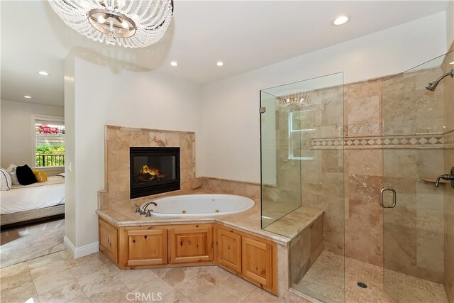 942 Lucerne Ln, Lake Arrowhead, CA 92352 - ensuite bathroom featuring a jetted tub, a stall shower, a chandelier, recessed lighting, and a fireplace