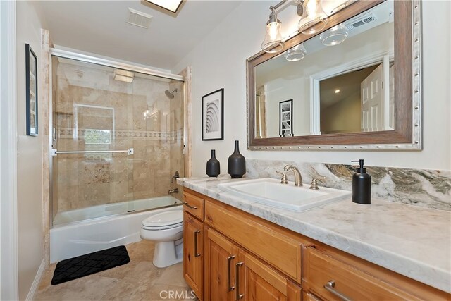 942 Lucerne Ln, Lake Arrowhead, CA 92352 - bathroom with toilet, vanity, enclosed tub / shower combo, and tile patterned flooring