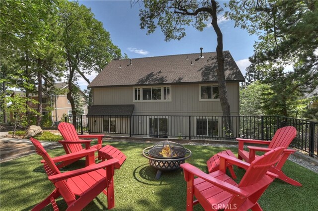942 Lucerne Ln, Lake Arrowhead, CA 92352 - back of house with an outdoor fire pit and roof with shingles