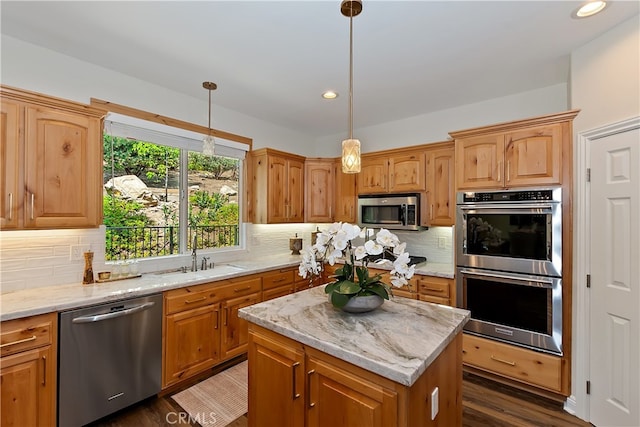 942 Lucerne Ln, Lake Arrowhead, CA 92352 - kitchen featuring appliances with stainless steel finishes, a sink, light stone counters, decorative backsplash, and recessed lighting