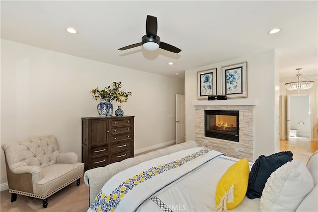942 Lucerne Ln, Lake Arrowhead, CA 92352 - bedroom featuring baseboards, recessed lighting, a tiled fireplace, ceiling fan, and a chandelier