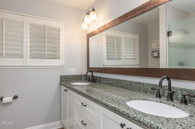 1091 Bradford Ave, Camarillo, CA 93010 - full bathroom with double vanity, a stall shower, and baseboards