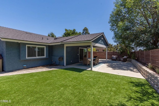 1091 Bradford Ave, Camarillo, CA 93010 - back of property with stucco siding, a patio, and roof with shingles