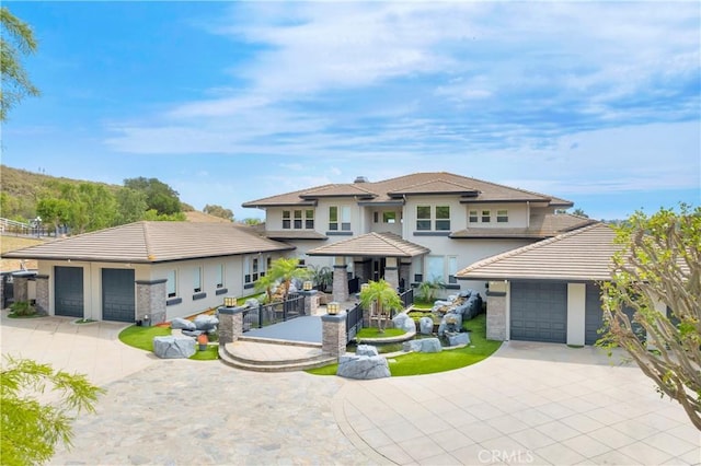 7 Olympic Way, Coto De Caza, CA 92679 - prairie-style house featuring concrete driveway and stucco siding