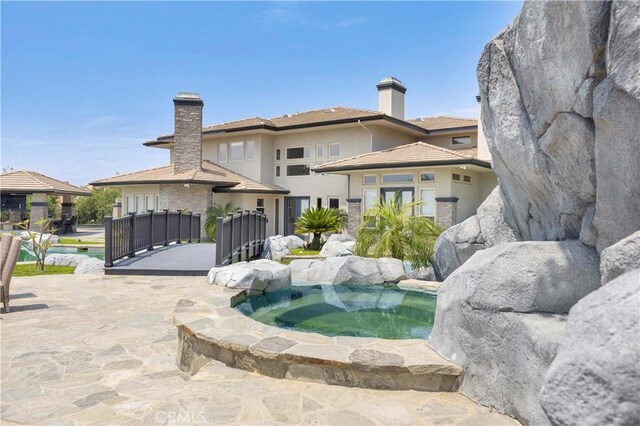 7 Olympic Way, Coto De Caza, CA 92679 - view of swimming pool with an in-ground hot tub, a swimming pool, and a patio area