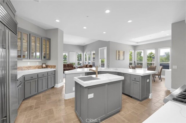 7 Olympic Way, Coto De Caza, CA 92679 - kitchen with a center island with sink, gray cabinets, recessed lighting, built in fridge, and healthy amount of natural light