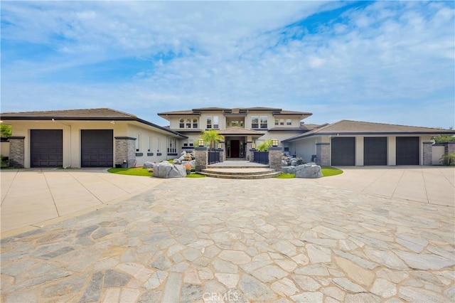 7 Olympic Way, Coto De Caza, CA 92679 - prairie-style house featuring driveway, a garage, and stucco siding