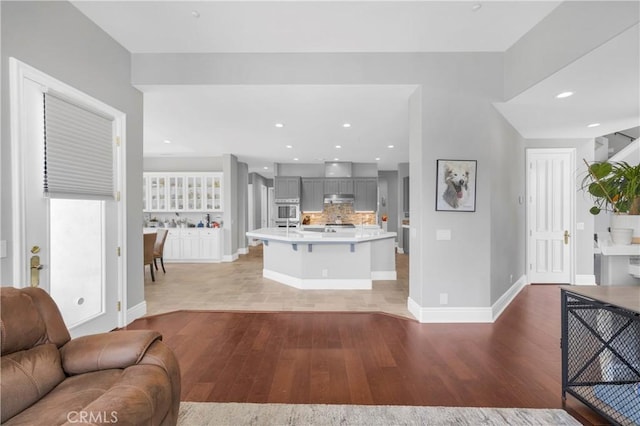 7 Olympic Way, Coto De Caza, CA 92679 - living room featuring light wood-style floors and recessed lighting