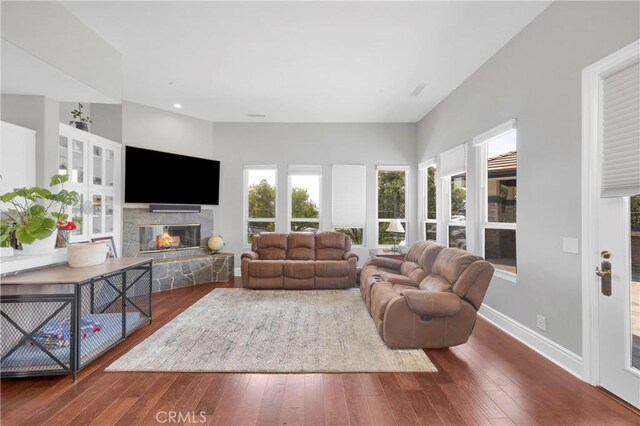 7 Olympic Way, Coto De Caza, CA 92679 - living area with wood-type flooring, a fireplace, and recessed lighting