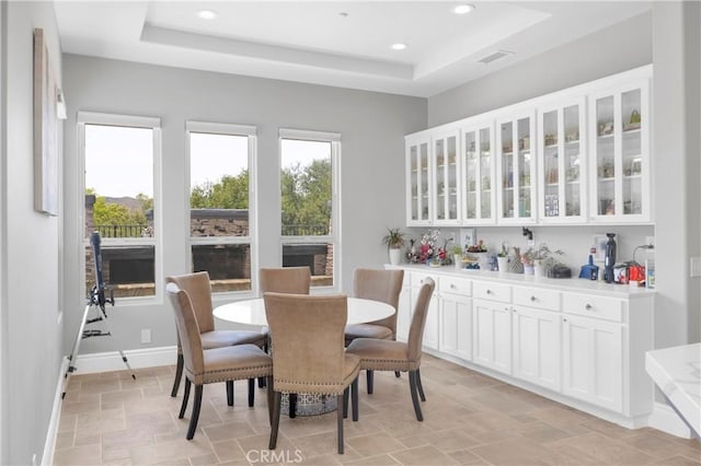7 Olympic Way, Coto De Caza, CA 92679 - dining area featuring a raised ceiling, light stone finish flooring, and recessed lighting