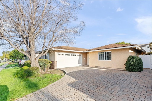 8065 E Ring St, Long Beach, CA 90808 - ranch-style house with a garage, stucco siding, and driveway