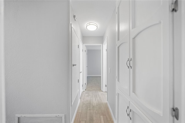 2712 Boundary Ln, Riverside, CA 92503 - corridor with light wood-style floors and baseboards