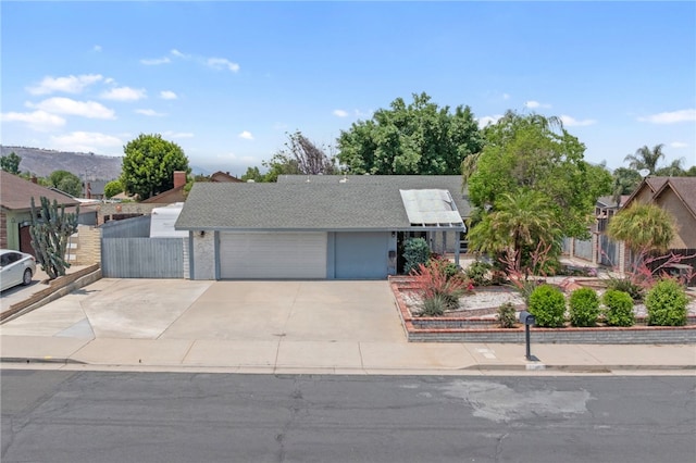 2712 Boundary Ln, Riverside, CA 92503 - view of front facade featuring concrete driveway and a shingled roof