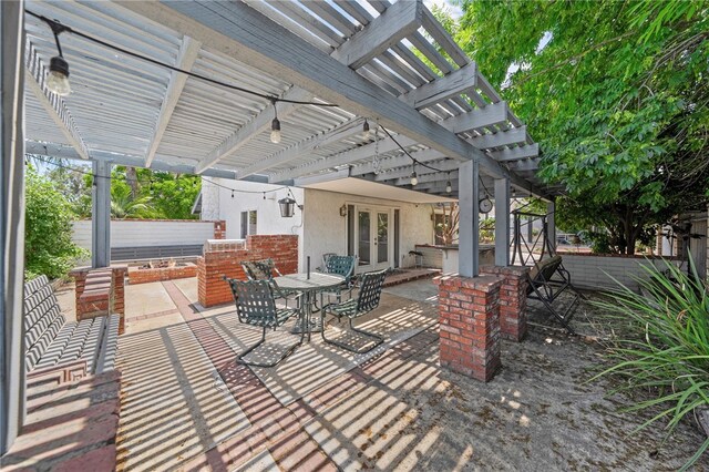 2712 Boundary Ln, Riverside, CA 92503 - view of patio featuring french doors, a pergola, and outdoor dining area