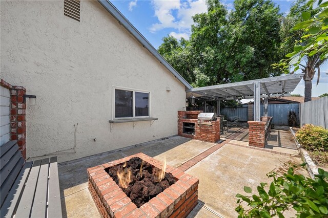 2712 Boundary Ln, Riverside, CA 92503 - fenced backyard featuring a fire pit and a patio
