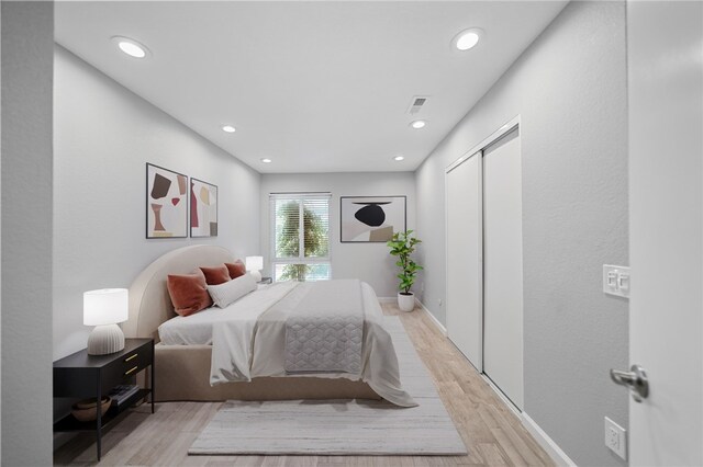 2712 Boundary Ln, Riverside, CA 92503 - bedroom with light wood-style flooring, recessed lighting, a closet, and baseboards