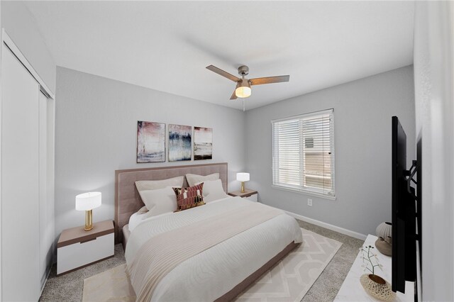 2712 Boundary Ln, Riverside, CA 92503 - bedroom with light colored carpet, baseboards, a closet, and a ceiling fan