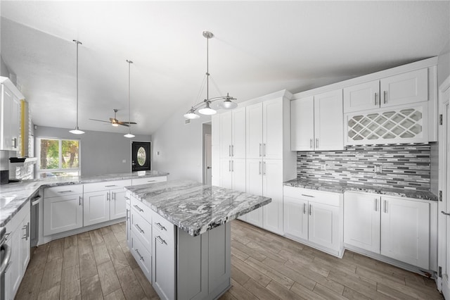 2712 Boundary Ln, Riverside, CA 92503 - kitchen featuring tasteful backsplash, a center island, light wood-type flooring, lofted ceiling, and ceiling fan