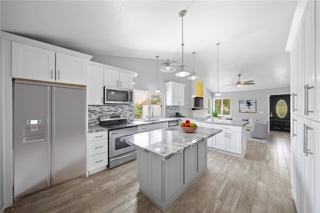 2712 Boundary Ln, Riverside, CA 92503 - kitchen with stainless steel appliances, a peninsula, a sink, open floor plan, and tasteful backsplash