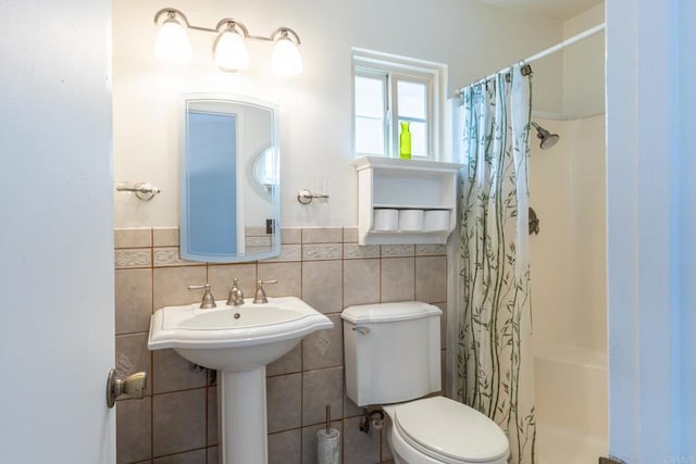2033 Winnett St, San Diego, CA 92114 - bathroom featuring tile walls, a shower with curtain, and wainscoting