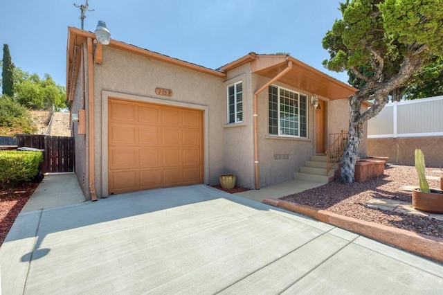 2033 Winnett St, San Diego, CA 92114 - view of front of property featuring a garage, driveway, and stucco siding