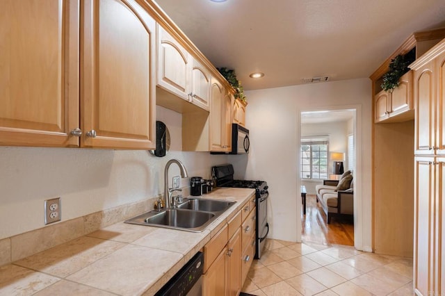 2033 Winnett St, San Diego, CA 92114 - kitchen featuring stainless steel appliances, tile countertops, light tile patterned floors, light brown cabinetry, and recessed lighting