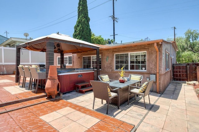 2033 Winnett St, San Diego, CA 92114 - view of patio / terrace featuring a hot tub, outdoor dining space, and a gazebo
