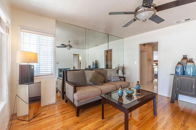 2033 Winnett St, San Diego, CA 92114 - living area with a ceiling fan and light wood-style flooring