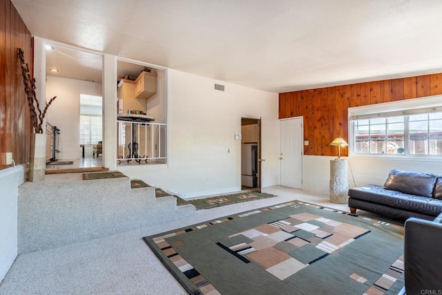2033 Winnett St, San Diego, CA 92114 - living room featuring healthy amount of natural light, carpet flooring, and wood walls