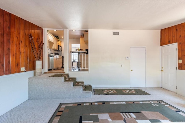 2033 Winnett St, San Diego, CA 92114 - carpeted foyer entrance featuring wood walls