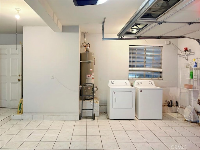 3855 Gilman Rd, El Monte, CA 91732 - laundry room featuring secured water heater, light tile patterned floors, and washing machine and dryer