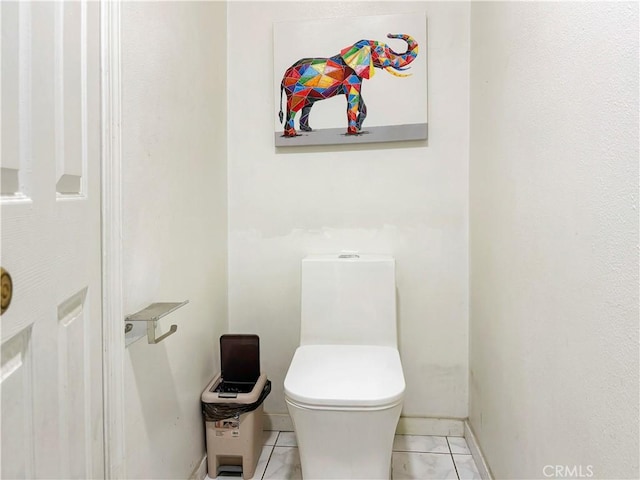 3855 Gilman Rd, El Monte, CA 91732 - bathroom featuring toilet, baseboards, and tile patterned floors