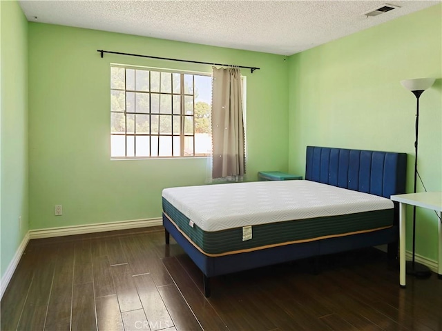 3855 Gilman Rd, El Monte, CA 91732 - bedroom with wood finished floors, baseboards, and a textured ceiling