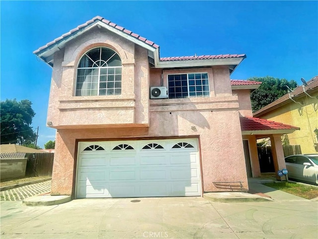 3855 Gilman Rd, El Monte, CA 91732 - view of front of property featuring stucco siding, concrete driveway, a garage, and a tiled roof