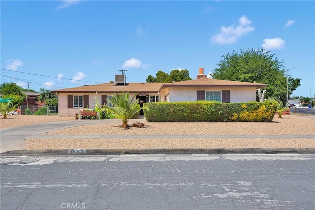 15506 Del Rey Dr, Victorville, CA 92395 - single story home with stucco siding, a chimney, and driveway