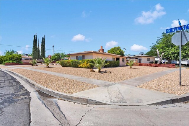 15506 Del Rey Dr, Victorville, CA 92395 - ranch-style home with a chimney and stucco siding
