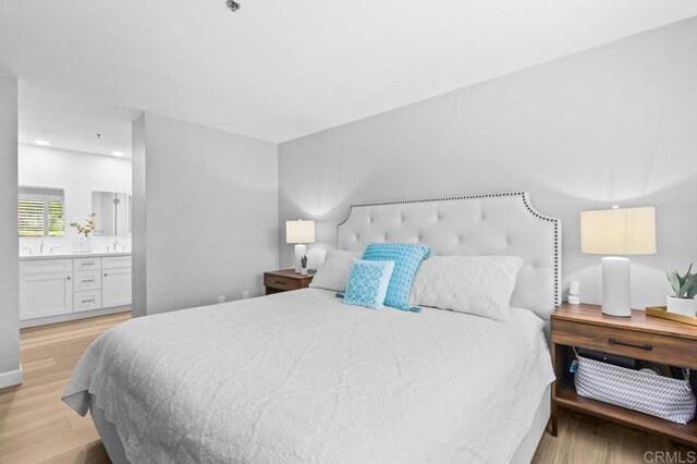 783 Brookstone Rd Unit 104, Chula Vista, CA 91913 - bedroom with light wood finished floors and connected bathroom