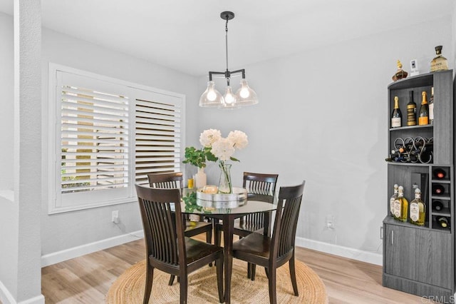 783 Brookstone Rd Unit 104, Chula Vista, CA 91913 - dining area with light wood finished floors and baseboards