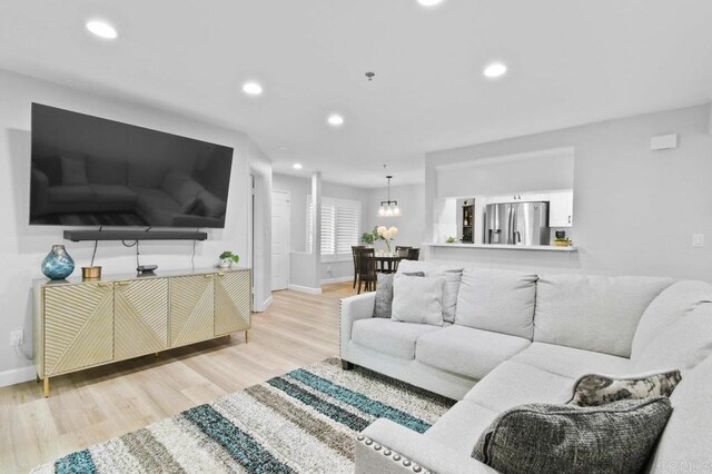 783 Brookstone Rd Unit 104, Chula Vista, CA 91913 - living room featuring wood finished floors and recessed lighting