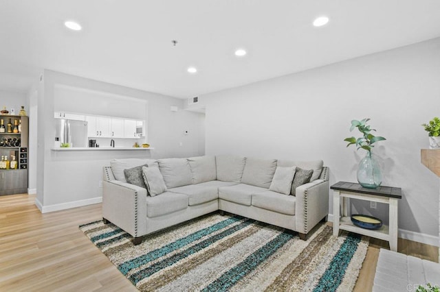 783 Brookstone Rd Unit 104, Chula Vista, CA 91913 - living area with recessed lighting, light wood-style floors, and a bar