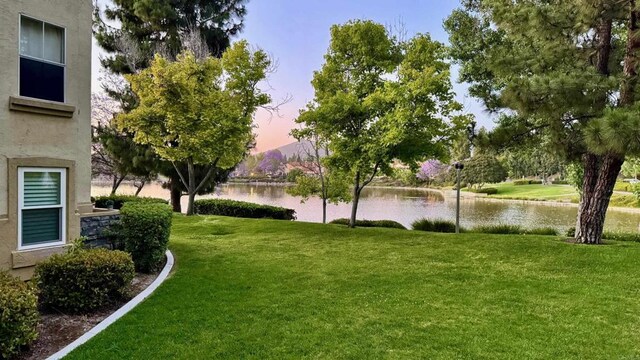 783 Brookstone Rd Unit 104, Chula Vista, CA 91913 - yard at dusk with a lawn and a water view