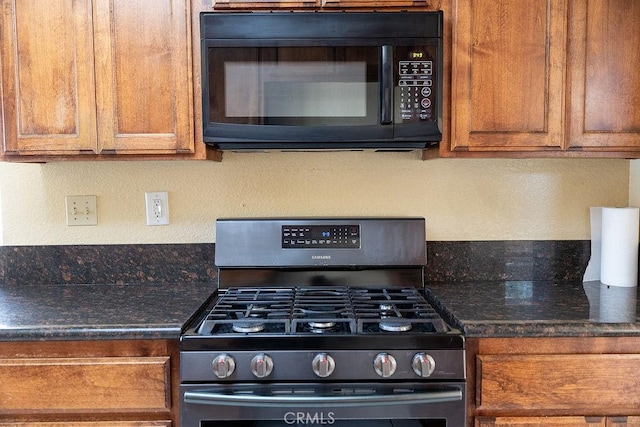 27474 Bolandra Ct, Temecula, CA 92591 - kitchen with gas range oven, black microwave, brown cabinets, and a textured wall