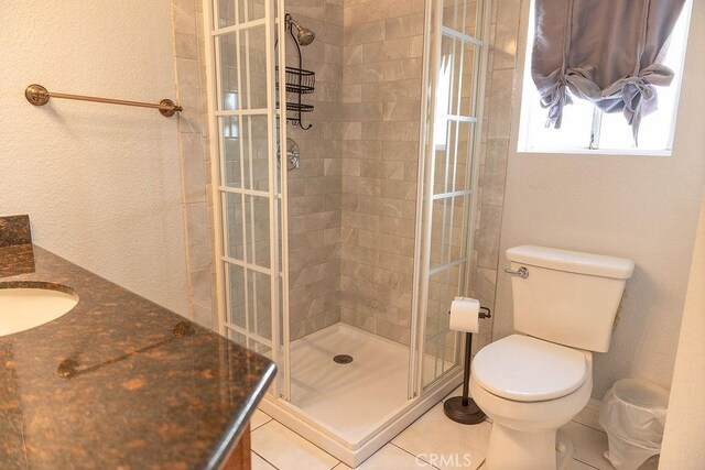 27474 Bolandra Ct, Temecula, CA 92591 - full bathroom with vanity, a tile shower, tile patterned flooring, and a textured wall