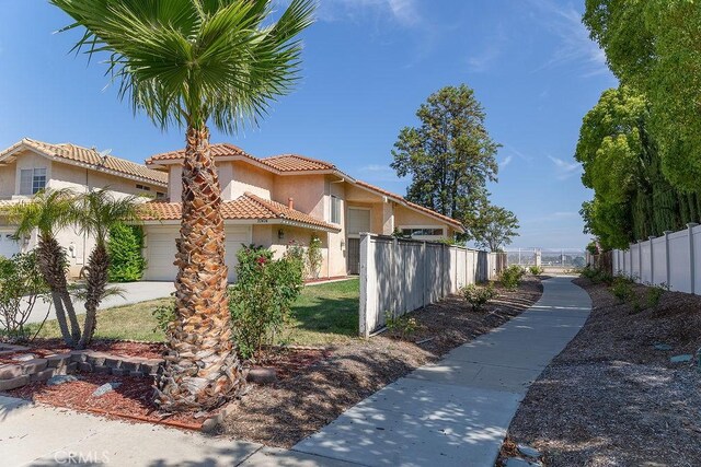 27474 Bolandra Ct, Temecula, CA 92591 - view of front facade with a tiled roof, stucco siding, and an attached garage