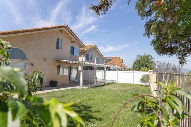 27474 Bolandra Ct, Temecula, CA 92591 - back of property with a pergola, a fenced backyard, a patio, stucco siding, and a tiled roof