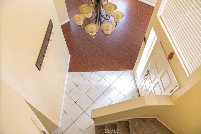 27474 Bolandra Ct, Temecula, CA 92591 - stairs featuring wood finished floors and a chandelier