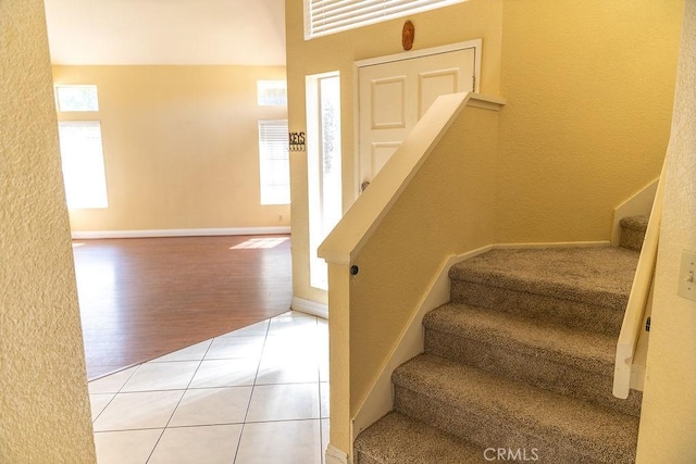 27474 Bolandra Ct, Temecula, CA 92591 - stairs with plenty of natural light, tile patterned floors, and a textured wall