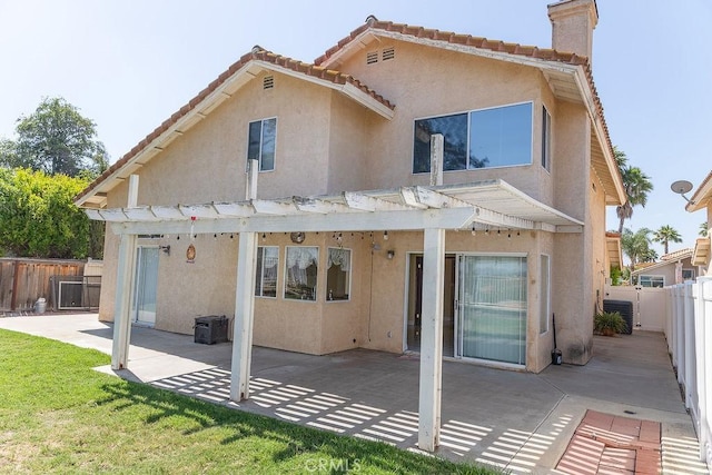 27474 Bolandra Ct, Temecula, CA 92591 - back of house with stucco siding, a pergola, a patio, a chimney, and a fenced backyard